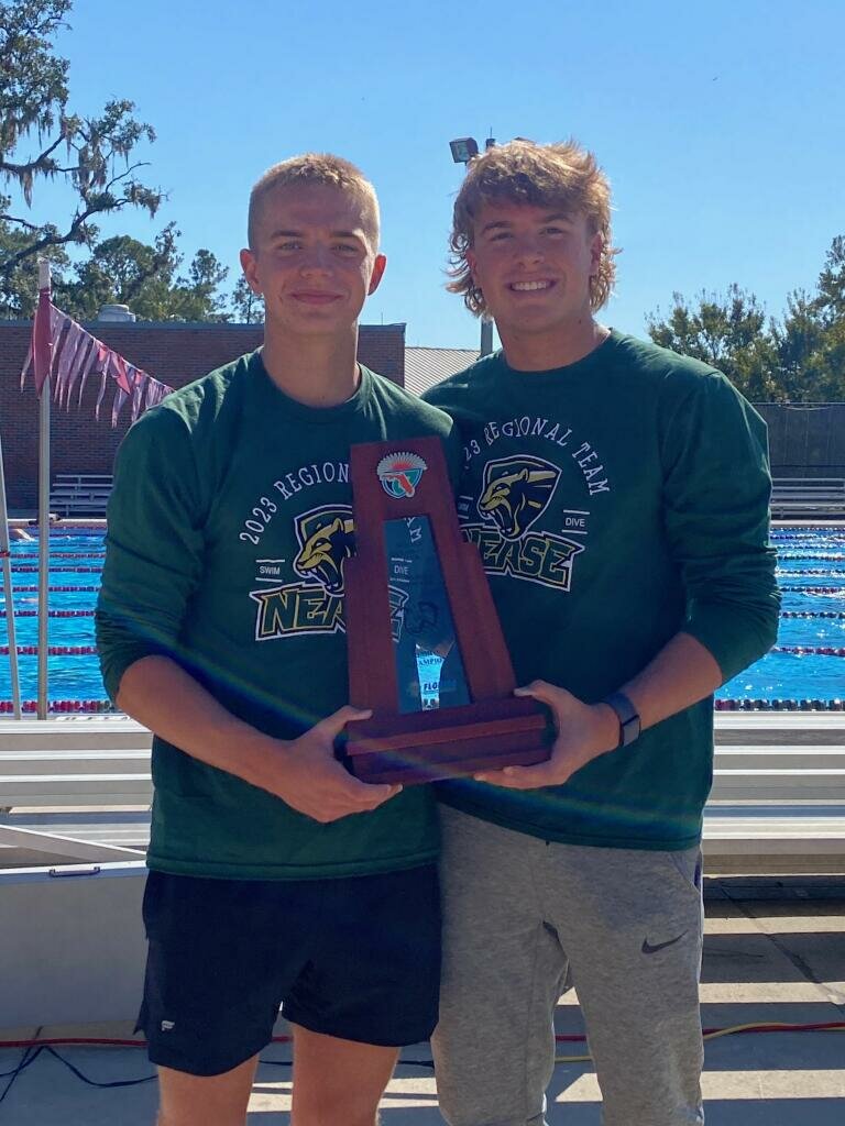 Nease captains Brandon Gear and Walker Lanoue with the regional championship trophy.